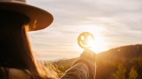 young woman looking into the sunset